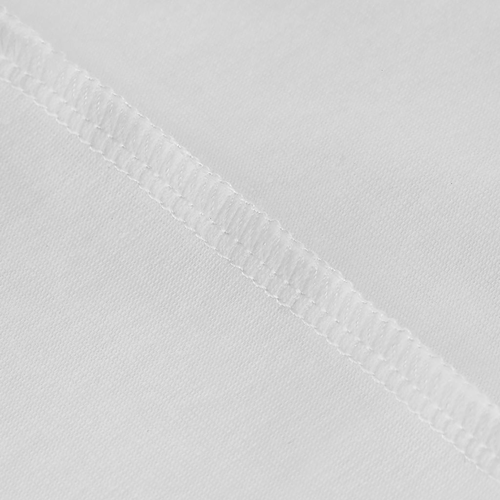 A close-up view of a white fabric with a single, straight, white thread running across it.