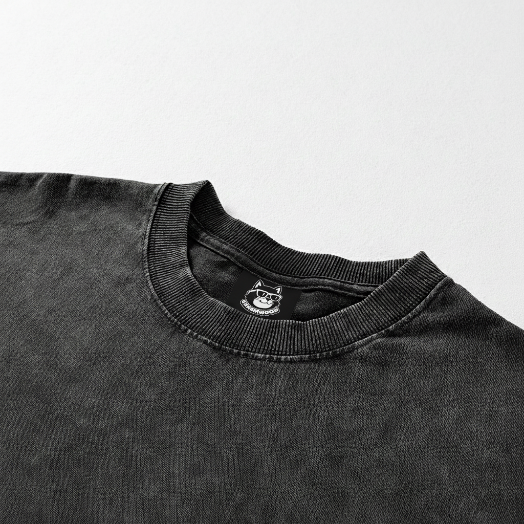 A black t-shirt with a small logo on the collar.