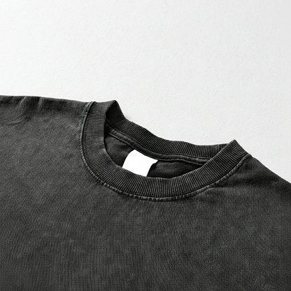 Close-up of a black shirt collar on a light gray background