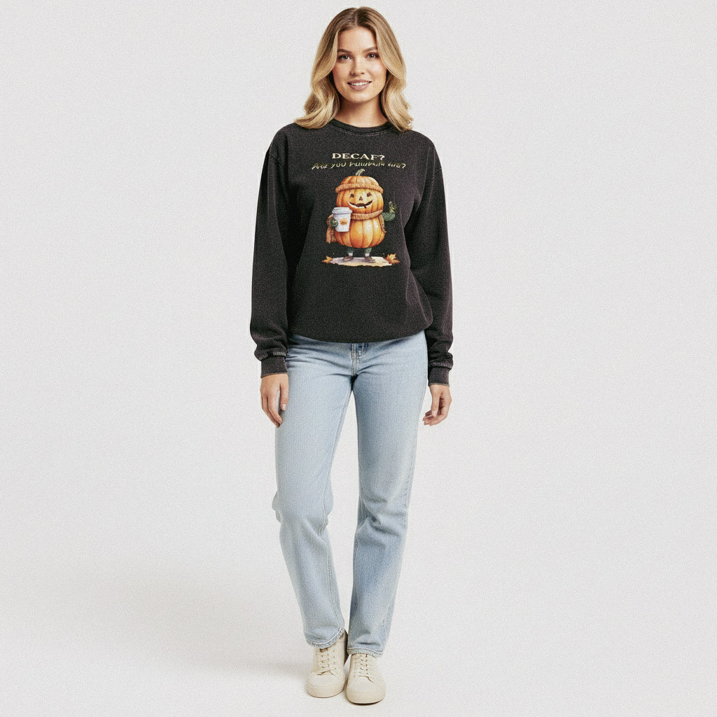 Woman wearing a black sweatshirt with a pumpkin graphic and text on a white background