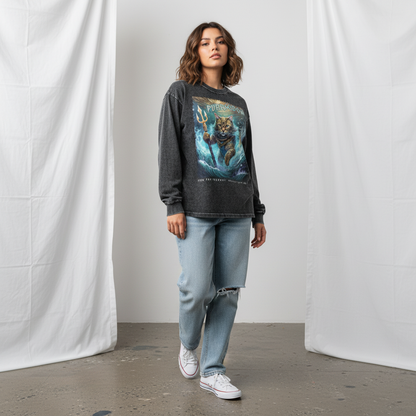 Person wearing a graphic sweatshirt and jeans standing against a plain background