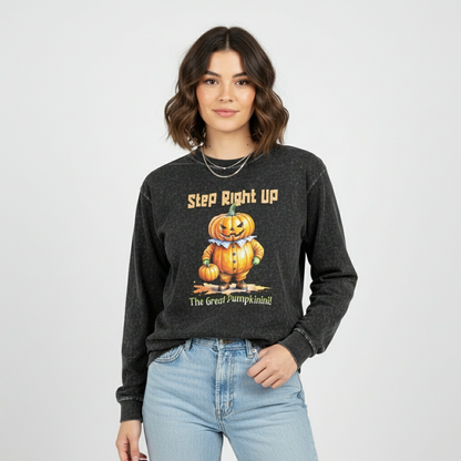 Person wearing a dark gray sweatshirt with a pumpkin graphic and text on a white background