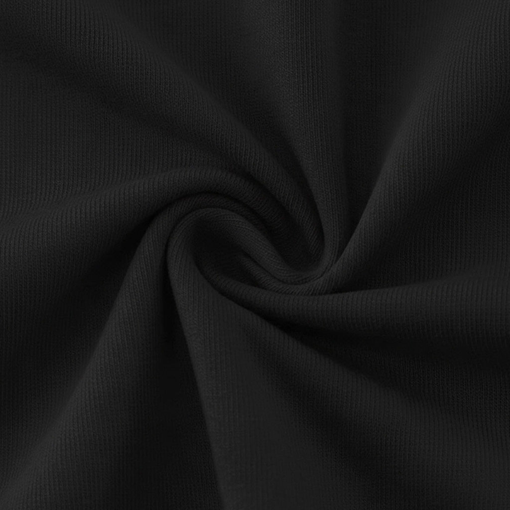 The image is a close-up of a black fabric, possibly a sweater or a shirt, with a twisted or curled pattern.
