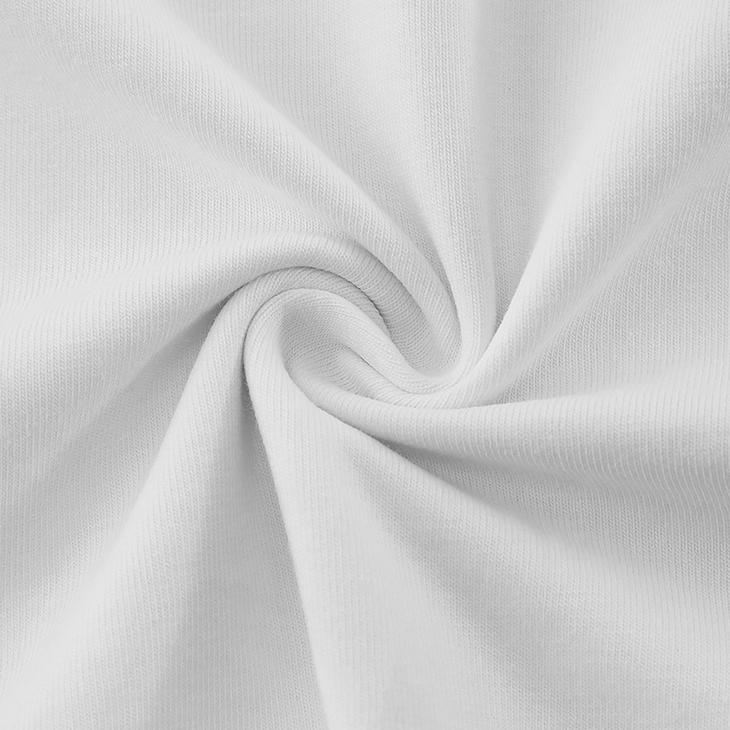 The image is a close-up of a white fabric, possibly a shirt, with a slight curl and texture.