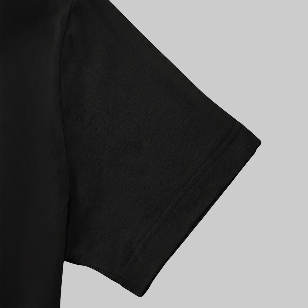 A close-up view of a black t-shirt sleeve.