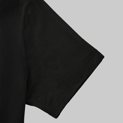 A close-up view of a black t-shirt sleeve.