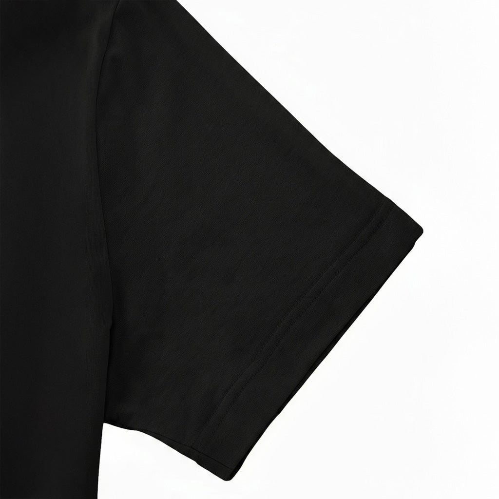 A close-up view of a black t-shirt sleeve.