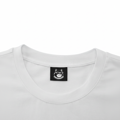 A white t-shirt with a small black label on the collar.