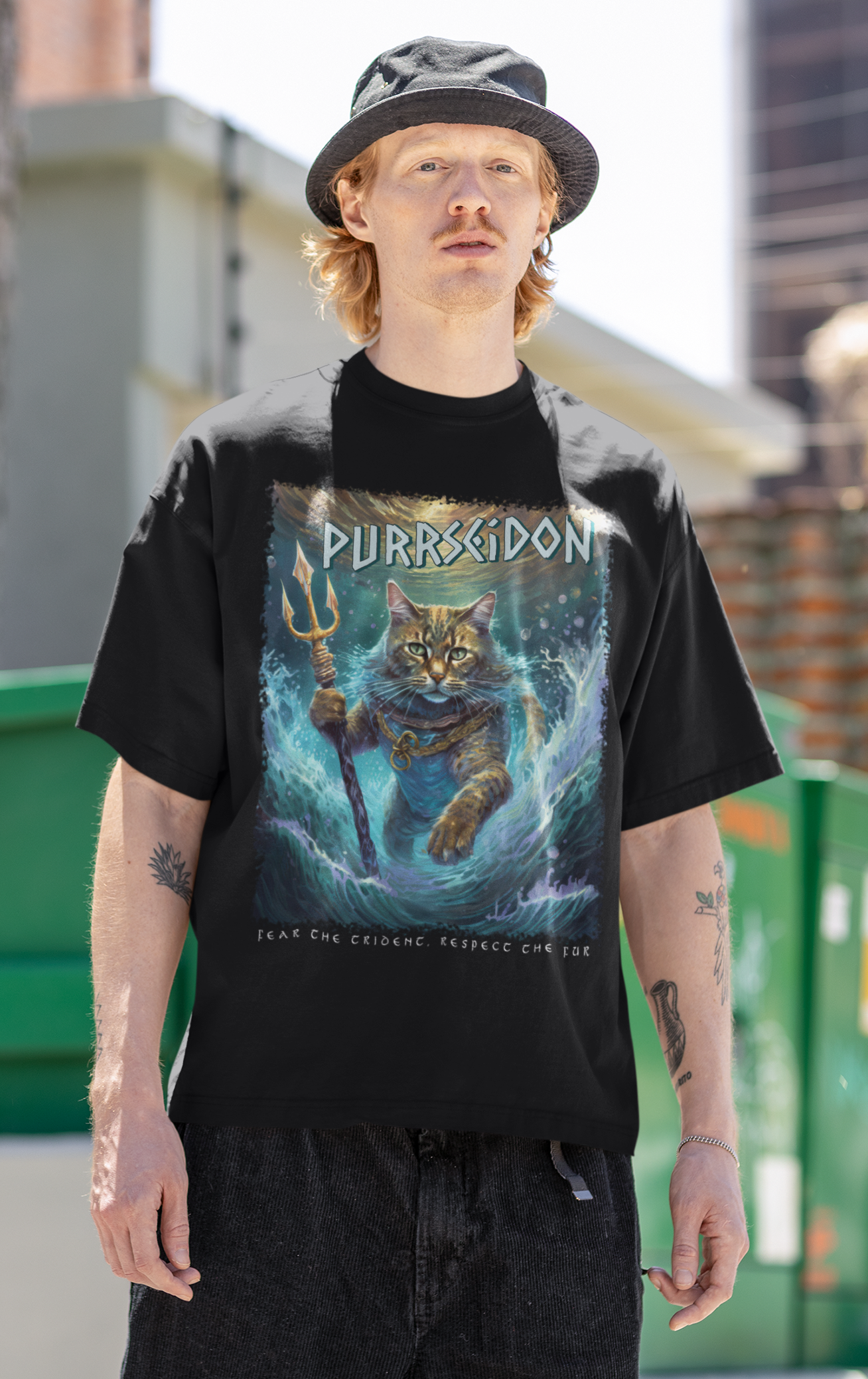 Person wearing a black t-shirt with a graphic design, standing outdoors.