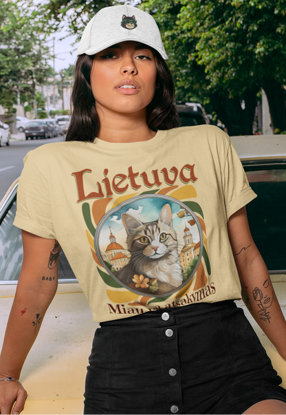 Person wearing a 'Lietuva' t-shirt with a cat graphic, leaning on a vintage car.